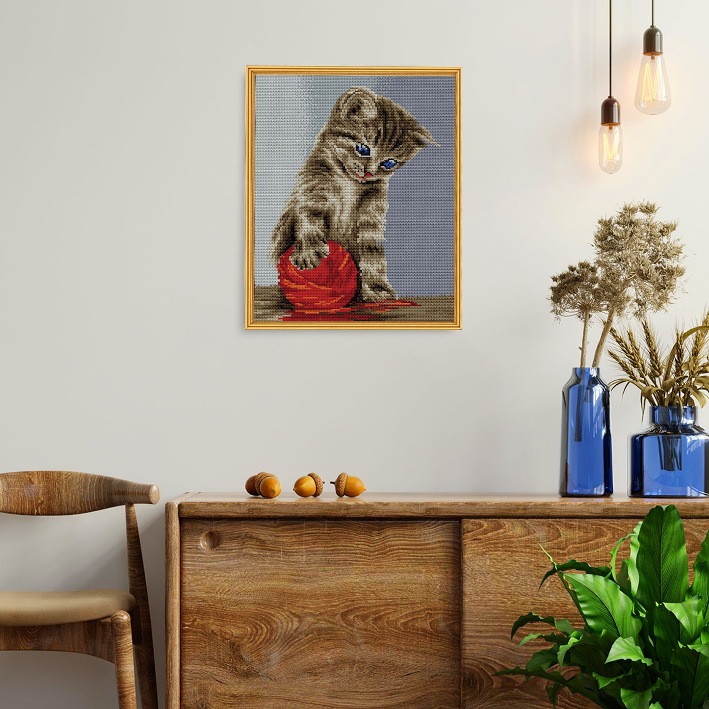 Kitten with a red clew